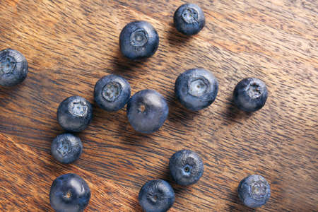 Many ripe blueberry on wooden backgroundの写真素材