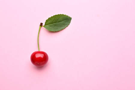Tasty ripe cherry on color backgroundの写真素材