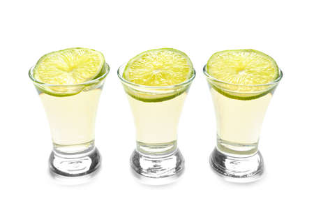 Shots of tequila on white backgroundの写真素材