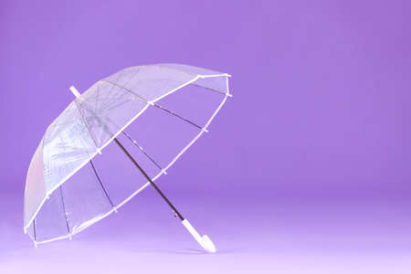 Stylish umbrella on color backgroundの写真素材
