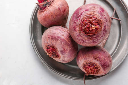 Plate with fresh beet on light backgroundの写真素材
