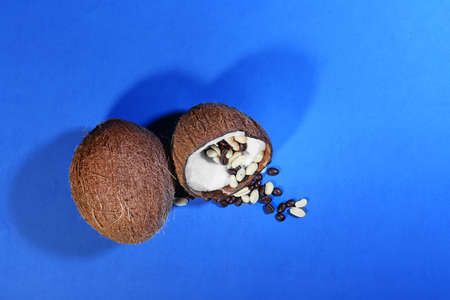 Tasty coconuts on color background