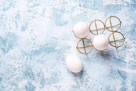 Stylish holder with eggs on color backgroundの写真素材