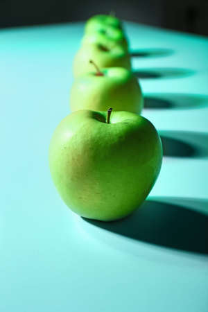 Tasty apples on color backgroundの写真素材