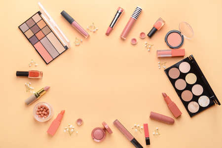 Frame made of decorative cosmetics on color backgroundの写真素材