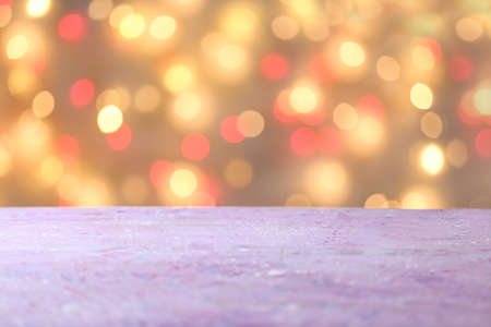 Closeup view of table against blurred lightsの写真素材