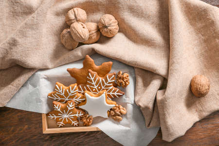 Box with tasty Christmas cookies on tableの写真素材