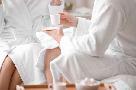 Morning of happy young couple in bedroomの写真素材