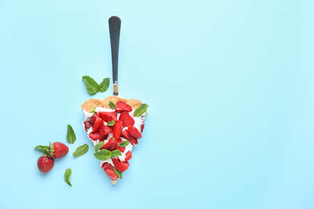 Piece of tasty strawberry cake on color background