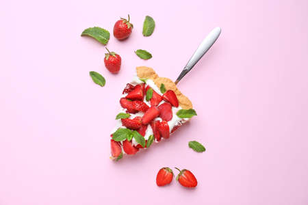 Piece of tasty strawberry cake on color backgroundの写真素材