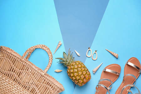 Composition with beach accessories on color background