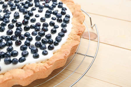 Tasty bilberry pie on wooden background, closeupの写真素材