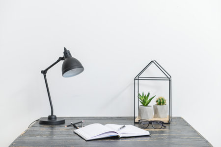 Stylish workplace near white wall in roomの写真素材