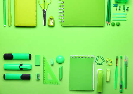 Set of school supplies on color background