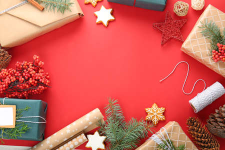 Frame made of beautiful Christmas gift boxes on color background