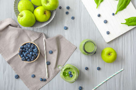 Composition with healthy smoothie and ingredients on tableの写真素材