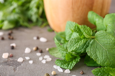 Fresh mint with spices on grunge background, closeupの写真素材