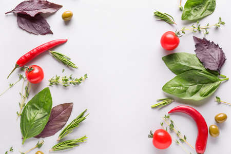 Fresh herbs with vegetables on white backgroundの写真素材