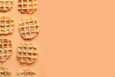 Tasty waffles on color backgroundの写真素材