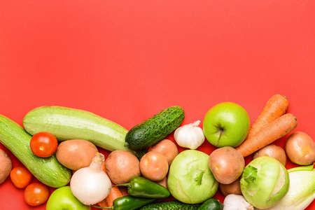 Assortment of fresh vegetables on color backgroundの写真素材