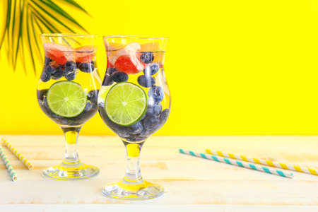 Glasses of tasty infused water on light tableの写真素材