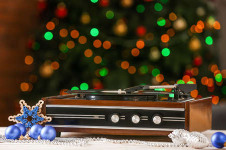 Record player and Christmas decor on tableの写真素材