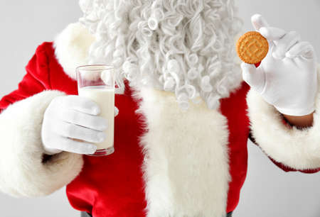 Santa Claus with milk and cookie on light background, closeupの写真素材