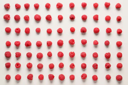 Tasty ripe raspberries on white background