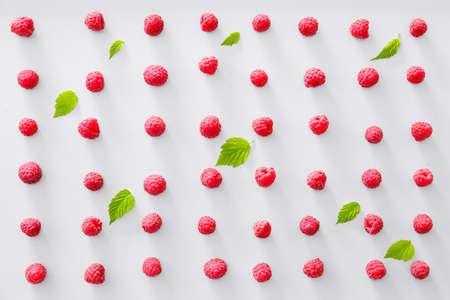 Tasty ripe raspberries on white background