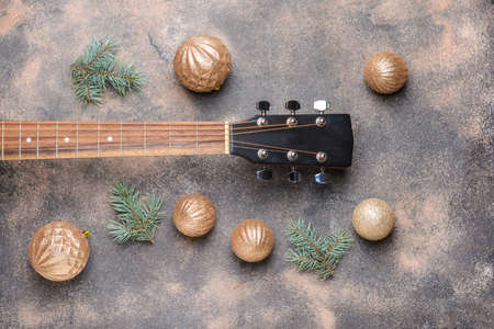 Guitar and Christmas decor on grunge backgroundの写真素材