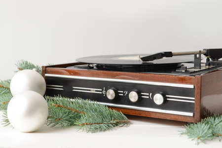 Retro player with Christmas decor on white background