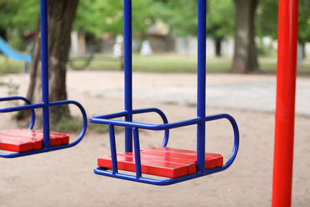 Swings on playground in park