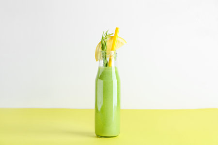 Bottle of tasty smoothie on tableの写真素材
