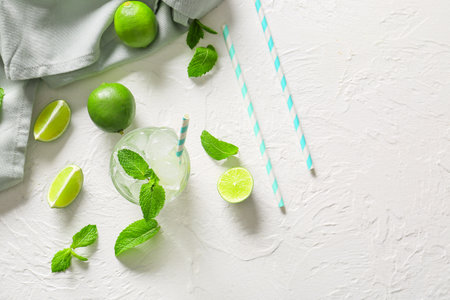 Composition with fresh mojito on white table