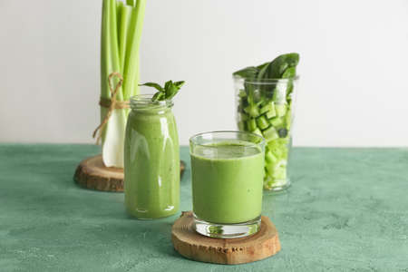 Tasty green smoothie on tableの写真素材