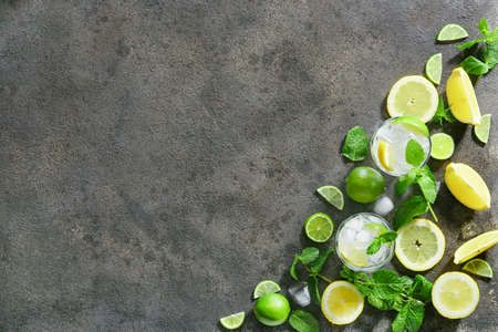 Composition with glasses of fresh mojito on gray background