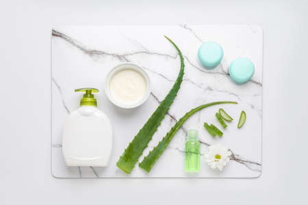 Cosmetic products with aloe leaves on white backgroundの写真素材
