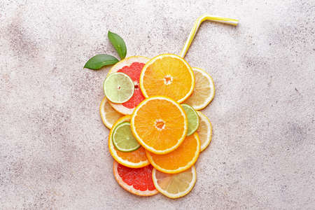 Different citrus fruits on gray backgroundの写真素材