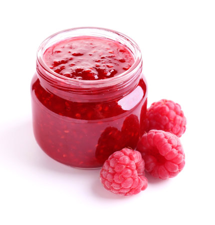 Jar of tasty raspberry jam on white backgroundの写真素材
