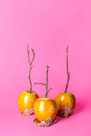 Tasty candy apples on color background