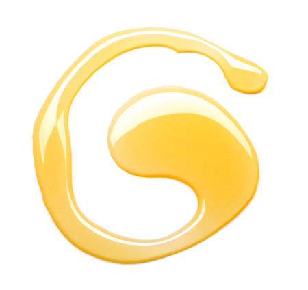 Spilled honey on white backgroundの写真素材