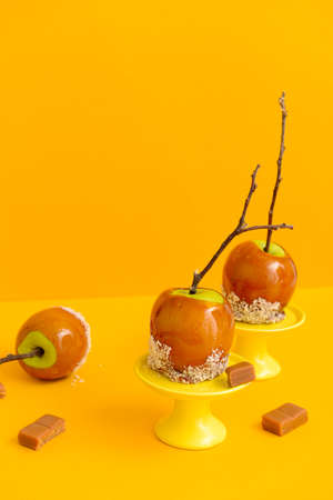 Tasty candy apples on color backgroundの写真素材