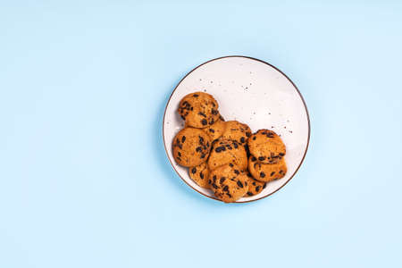 Plate with tasty cookies on color backgroundの写真素材