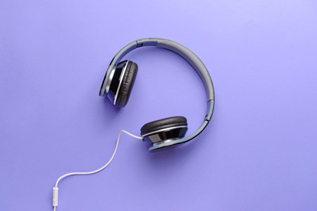 Modern headphones on color backgroundの写真素材