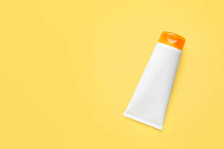Tube of sun protection cream on color backgroundの写真素材