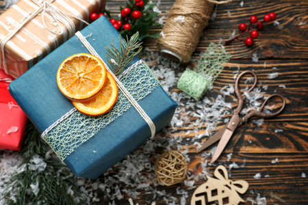 Beautiful Christmas gift boxes on wooden tableの写真素材