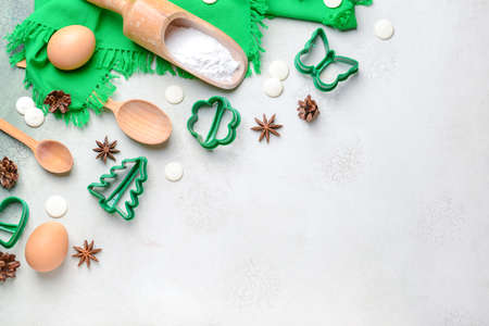 Cookie cutters with ingredients on light backgroundの写真素材