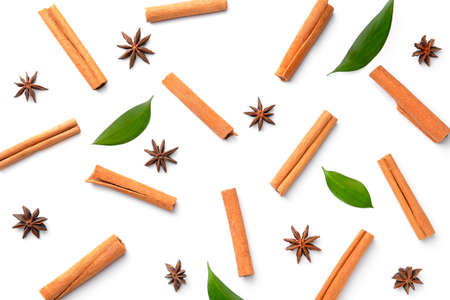 Aromatic cinnamon sticks and anise stars on white backgroundの写真素材