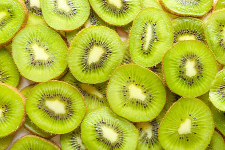 Slices of ripe kiwi as background