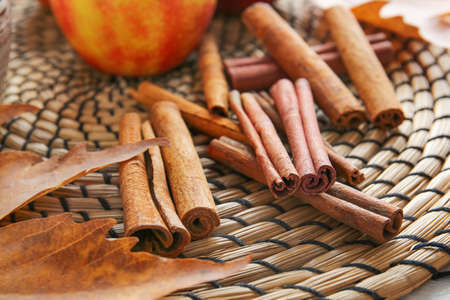 Aromatic cinnamon on mat closeupの写真素材
